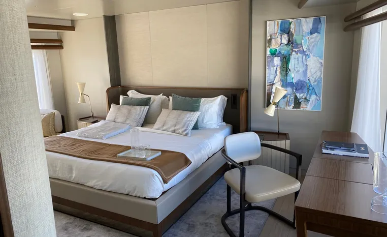 Luxurious bedroom interior on 2024 Azimut Magellano 30M yacht, featuring modern decor and elegant furnishings.