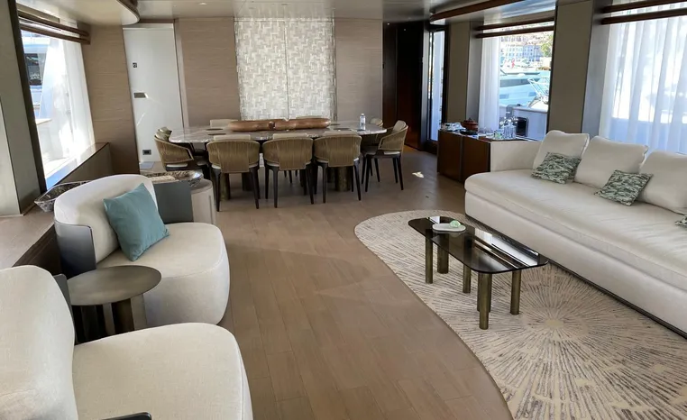 Luxurious interior of 2024 Azimut Magellano 30M yacht with elegant seating and dining area.