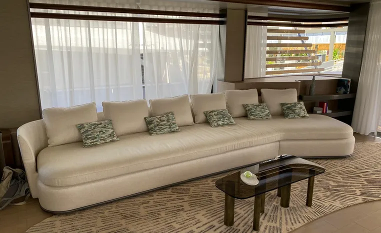 Luxurious interior of 2024 Azimut Magellano 30M yacht with elegant sofa and modern decor.