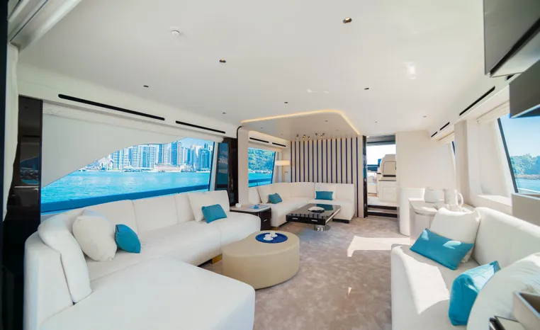 Luxurious interior of 2025 Azimut Fly 78 yacht with elegant white and blue decor.