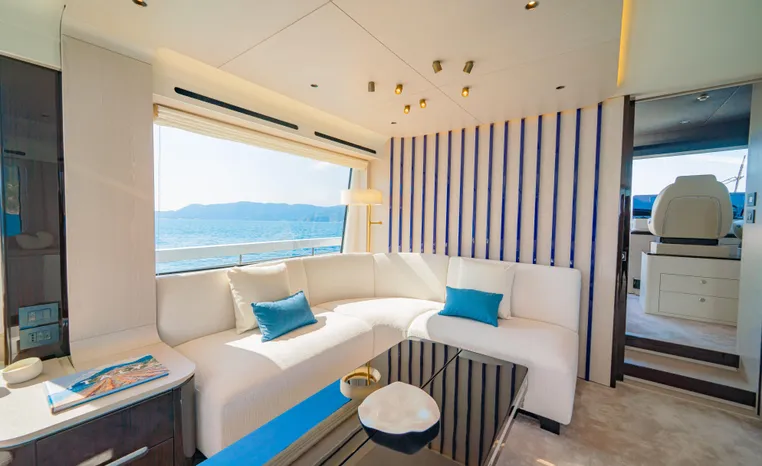 Luxurious interior of 2025 Azimut Fly 78 yacht with elegant seating and ocean view.