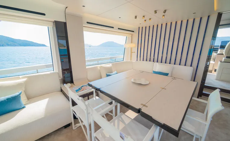 Luxurious interior of 2025 Azimut Fly 78 yacht with ocean view and modern decor.