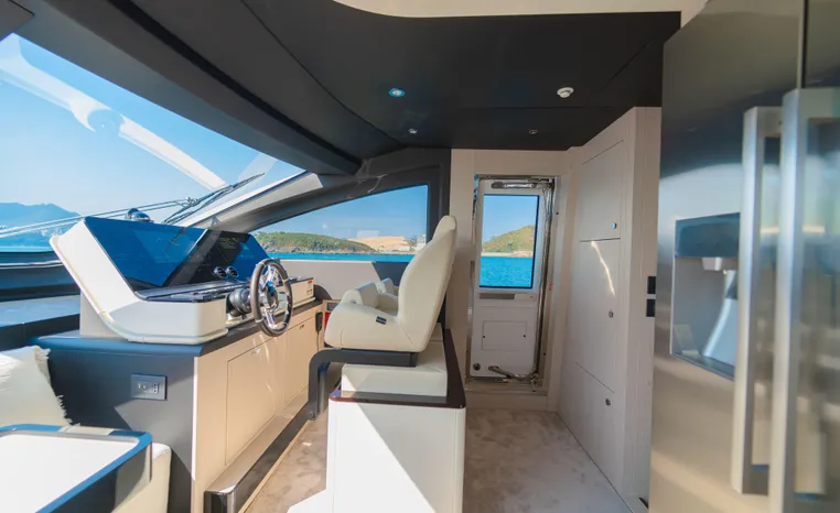 Luxurious interior of 2025 Azimut Fly 78 yacht with modern helm and ocean view.
