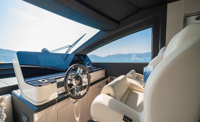 Luxurious interior of 2025 Azimut Fly 78 yacht with modern helm and plush seating.